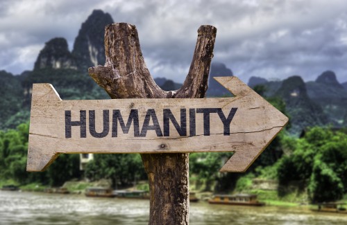 Humanity wooden sign with a forest background